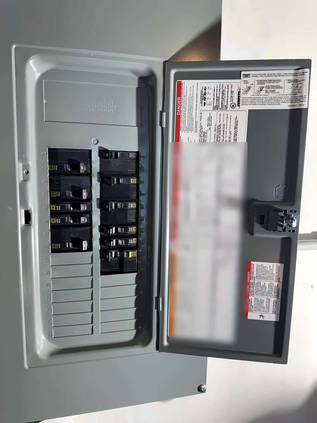 New 200-amp electrical panel with breakers after a service upgrade